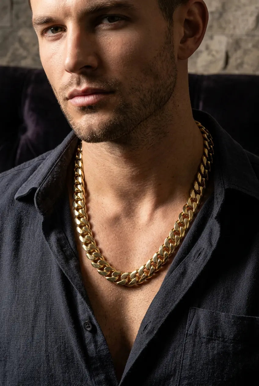 Man wearing bold 12mm Cuban link gold chain at 22-inch length showing statement-making thick width styling