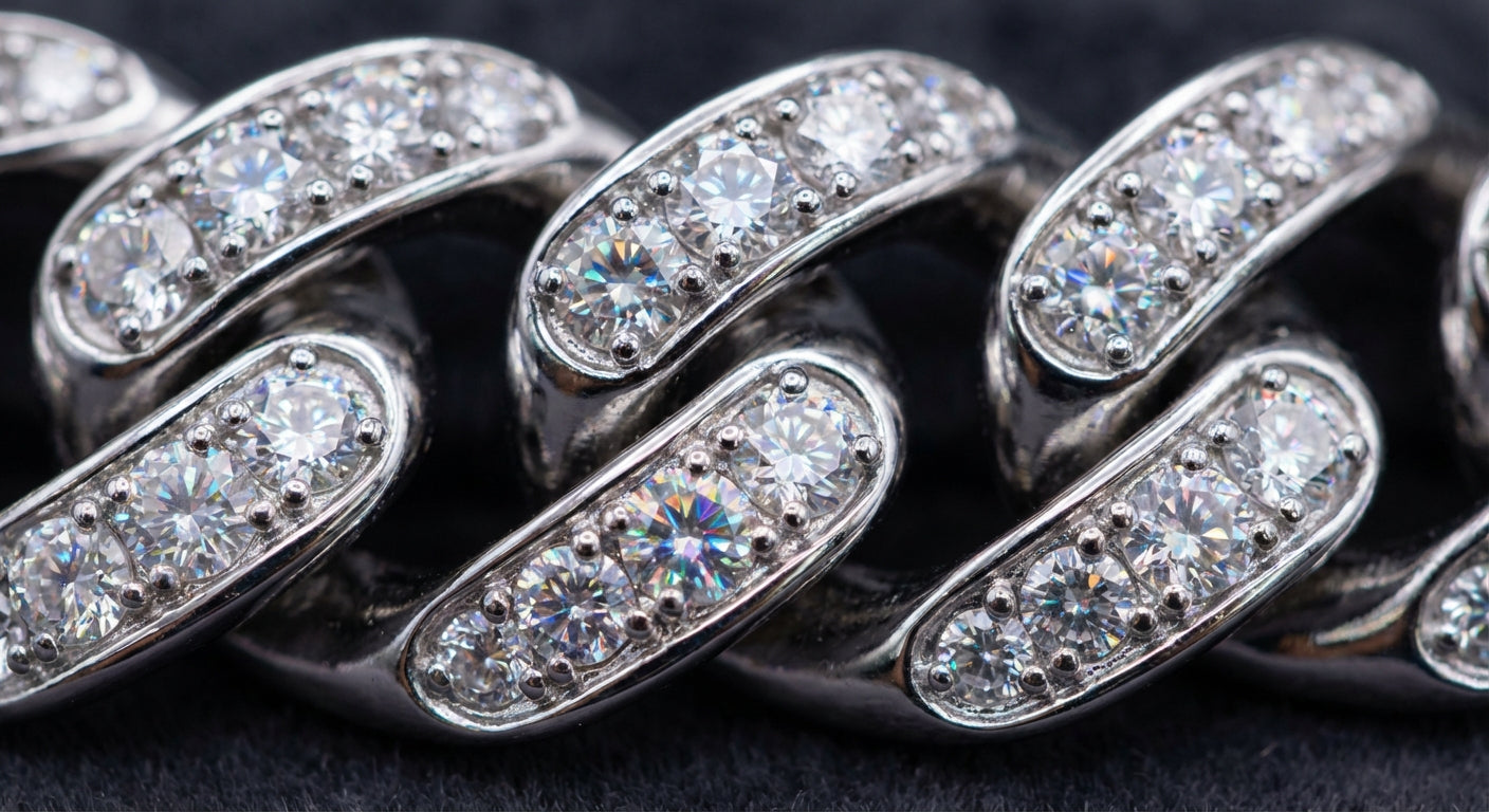 Close-up of moissanite stones set in a Cuban link chain showing brilliant rainbow fire dispersion