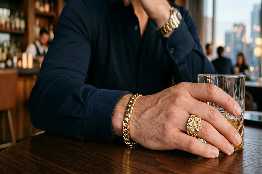 Gold nugget ring with diamond accents styled with Cuban link bracelet on man's wrist — urban luxury men's jewelry